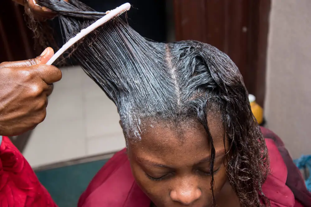 black woman hair relaxer application cancer